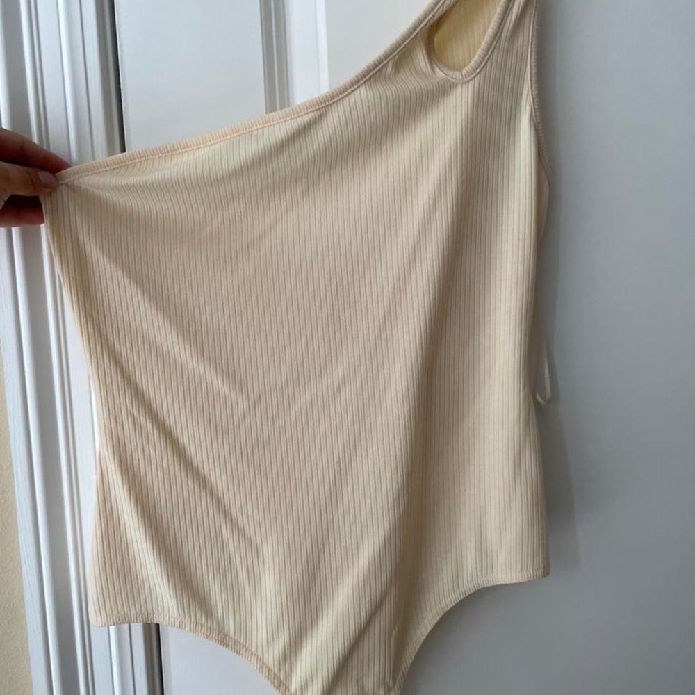 Miss Lola cream one shoulder bodysuit. Never worn.